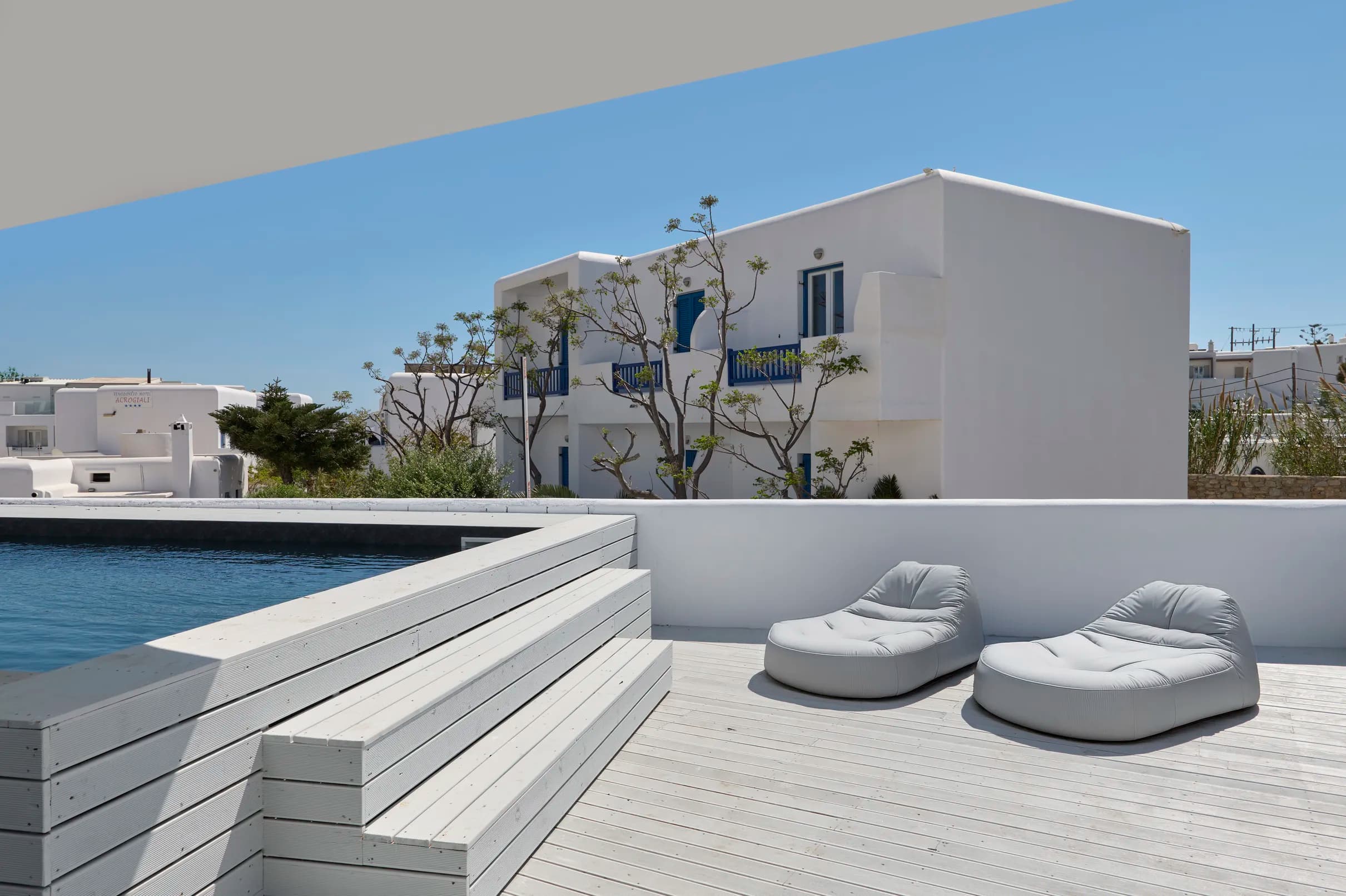 The Amaya pool with sun loungers on the timber deck